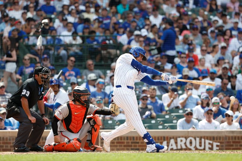 Jun 19, 2024; Chicago, Illinois, USA; Chicago Cubs outfielder Cody Bellinger (24) singles against the San Francisco Giants during the seventh inning at Wrigley Field. Mandatory Credit: Kamil Krzaczynski-USA TODAY Sports