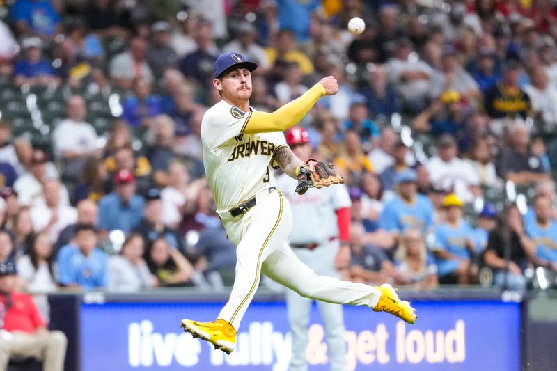 Sep 17, 2024; Milwaukee, Wisconsin, USA;  Milwaukee Brewers third baseman Joey Ortiz (3) throws to first base during the sixth inning against the Philadelphia Phillies at American Family Field. Mandatory Credit: Jeff Hanisch-Imagn Images