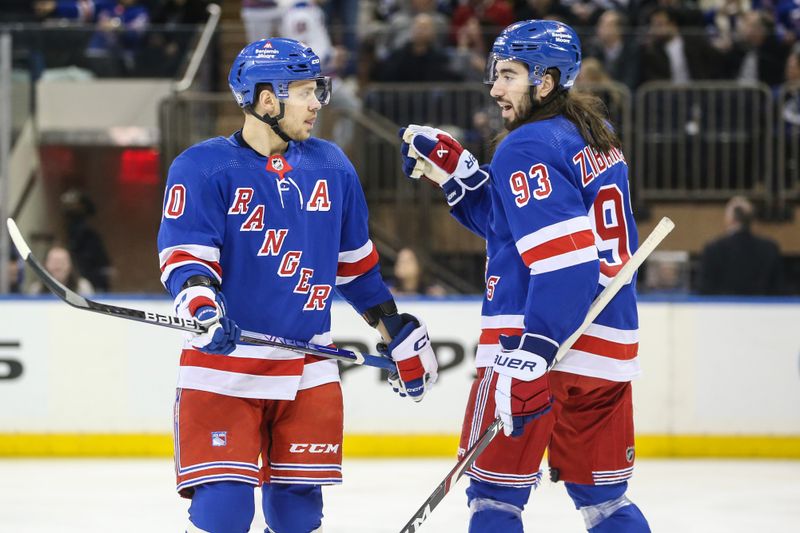 Jan 8, 2024; New York, New York, USA;  New York Rangers left wing Artemi Panarin (10) and center Mika Zibanejad (93) talk at the start of the game against the Vancouver Canucks at Madison Square Garden. Mandatory Credit: Wendell Cruz-USA TODAY Sports