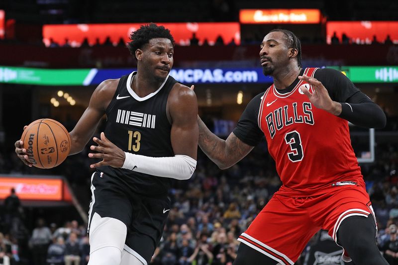 MEMPHIS, TENNESSEE - FEBRUARY 08: Jaren Jackson Jr. #13 of the Memphis Grizzlies handles the ball against Andre Drummond #3 of the Chicago Bulls during the second half at FedExForum on February 08, 2024 in Memphis, Tennessee. NOTE TO USER: User expressly acknowledges and agrees that, by downloading and or using this photograph, User is consenting to the terms and conditions of the Getty Images License Agreement. (Photo by Justin Ford/Getty Images)