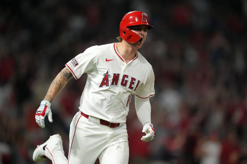 Aug 31, 2024; Anaheim, California, USA; Los Angeles Angels center fielder Mickey Moniak (16) celebrates after hitting a walk-off home run in the ninth inning against the Seattle Mariners at Angel Stadium. Mandatory Credit: Kirby Lee-USA TODAY Sports