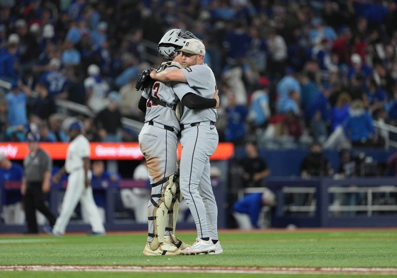 May 18, 2025; Toronto, Ontario, CAN; Detroit Tigers catcher Dillon Dingler (13) celebrates the win with relief pitcher Will Vest (19) against the Toronto Blue Jays at the end of the ninth inning at Rogers Centre. Mandatory Credit: Nick Turchiaro-Imagn Images