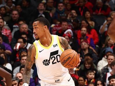 TORONTO, CANADA - DECEMBER 23:  John Collins #20 of the Utah Jazz handles the ball during the game against the Toronto Raptors on December 23, 2023 at the Scotiabank Arena in Toronto, Ontario, Canada.  NOTE TO USER: User expressly acknowledges and agrees that, by downloading and or using this Photograph, user is consenting to the terms and conditions of the Getty Images License Agreement.  Mandatory Copyright Notice: Copyright 2023 NBAE (Photo by Vaughn Ridley/NBAE via Getty Images)