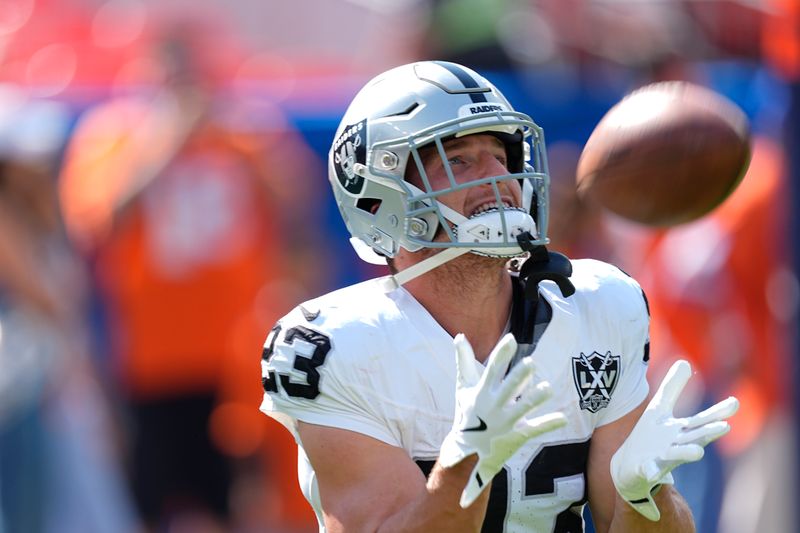 Las Vegas Raiders running back Dylan Laube catches during pregame of an NFL football game against the Denver Broncos, Sunday, Oct. 6, 2024, in Denver. (AP Photo/David Zalubowski)