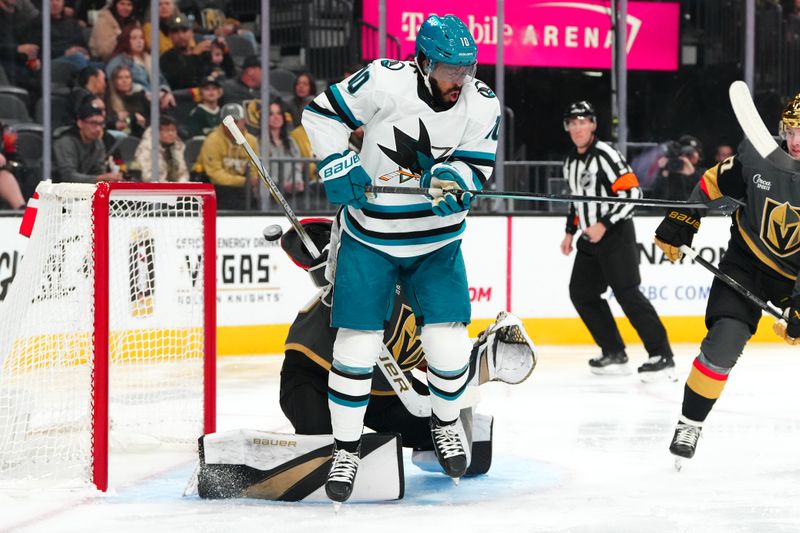 Dec 10, 2023; Las Vegas, Nevada, USA; San Jose Sharks defenseman Mario Ferraro (38) (not pictured) scores as left wing Anthony Duclair (10) screens Vegas Golden Knights goaltender Jiri Patera (30) during the first period at T-Mobile Arena. Mandatory Credit: Stephen R. Sylvanie-USA TODAY Sports