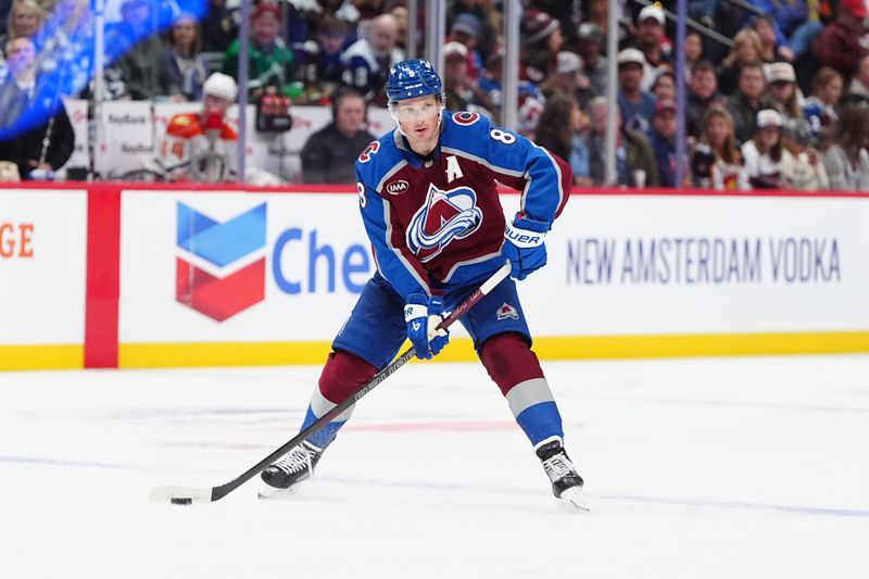 Oct 18, 2024; Denver, Colorado, USA; Colorado Avalanche defenseman Cale Makar (8) controls the puck in the second period against the Anaheim Ducks at Ball Arena. Mandatory Credit: Ron Chenoy-Imagn Images