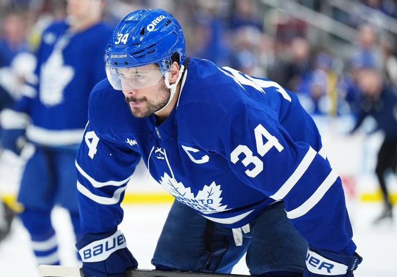 Jan 10, 2026; Toronto, Ontario, CAN; Toronto Maple Leafs center Auston Matthews (34) waits for the faceoff against the Vancouver Canucks during the first period at Scotiabank Arena. Mandatory Credit: Nick Turchiaro-Imagn Images