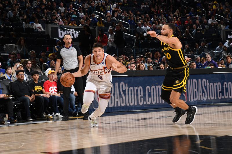 SAN FRANCISCO, CA - FEBRUARY 10: Grayson Allen #8 of the Phoenix Suns drives to the basket during the game against the Golden State Warriors on February 10, 2024 at Chase Center in San Francisco, California. NOTE TO USER: User expressly acknowledges and agrees that, by downloading and or using this photograph, user is consenting to the terms and conditions of Getty Images License Agreement. Mandatory Copyright Notice: Copyright 2024 NBAE (Photo by Noah Graham/NBAE via Getty Images)