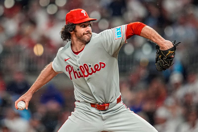 Jun 28, 2025; Cumberland, Georgia, USA; Philadelphia Phillies relief pitcher Jordan Romano (68) pitches against the Atlanta Braves during the seventh inning at Truist Park. Mandatory Credit: Dale Zanine-Imagn Images