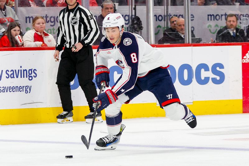 Mar 19, 2024; Detroit, Michigan, USA; Columbus Blue Jackets defenseman Zach Werenski (8) handles the puck during the first period of the game against the Detroit Red Wings at Little Caesars Arena. Mandatory Credit: Brian Bradshaw Sevald-USA TODAY Sports