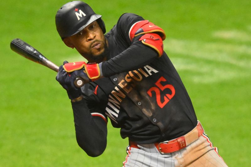 Sep 17, 2024; Cleveland, Ohio, USA; Minnesota Twins center fielder Byron Buxton (25) reacts to an inside pitch in the ninth inning against the Cleveland Guardians at Progressive Field. Mandatory Credit: David Richard-Imagn Images