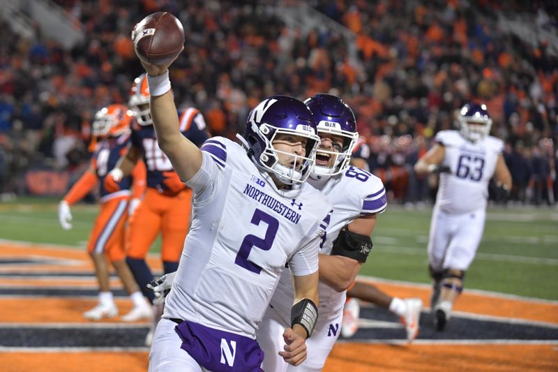 Nov 25, 2023; Champaign, Illinois, USA; Northwestern Wildcats quarterback Ben Bryant (2) scores a touchdown run during the second half against the Illinois Fighting Illini at Memorial Stadium. Mandatory Credit: Ron Johnson-USA TODAY Sports