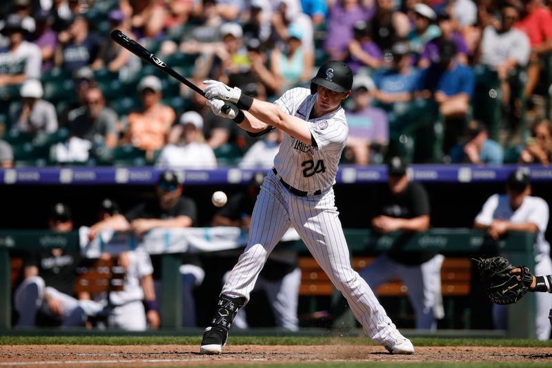 Jul 16, 2023; Denver, Colorado, USA; Colorado Rockies third baseman Ryan McMahon (24) hits a single to load the bases in the eighth inning against the New York Yankees at Coors Field. Mandatory Credit: Isaiah J. Downing-USA TODAY Sports