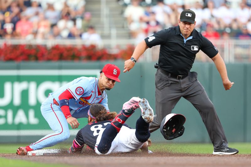 Aug 24, 2024; Minneapolis, Minnesota, USA; Minnesota Twins center fielder Austin Martin (82) slides into second base as St. Louis Cardinals shortstop Masyn Winn (0) attempts to field the ball during the third inning at Target Field. Mandatory Credit: Matt Krohn-USA TODAY Sports