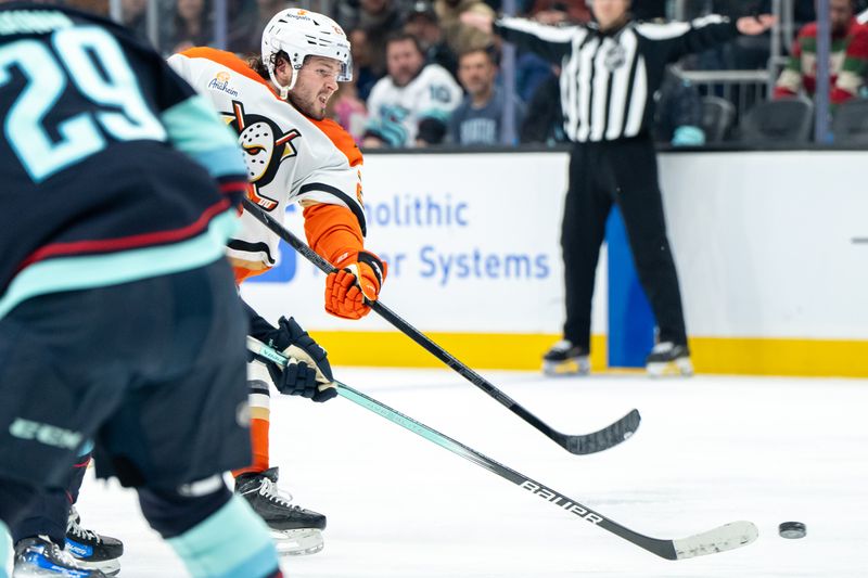 Jan 28, 2025; Seattle, Washington, USA;  Anaheim Ducks forward Mason McTavish (23) takes a shot during the third period against the Seattle Kraken at Climate Pledge Arena. Mandatory Credit: Stephen Brashear-Imagn Images