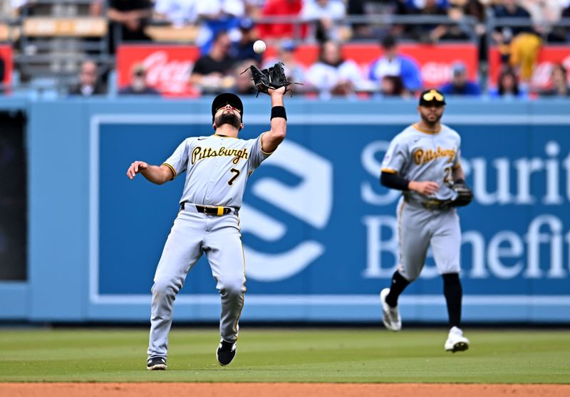 Apr 27, 2025; Los Angeles, California, USA; Pittsburgh Pirates shortstop Isiah Kiner-Falefa (7) makes a catch during the third inning against the Los Angeles Dodgers at Dodger Stadium. Mandatory Credit: Jonathan Hui-Imagn Images