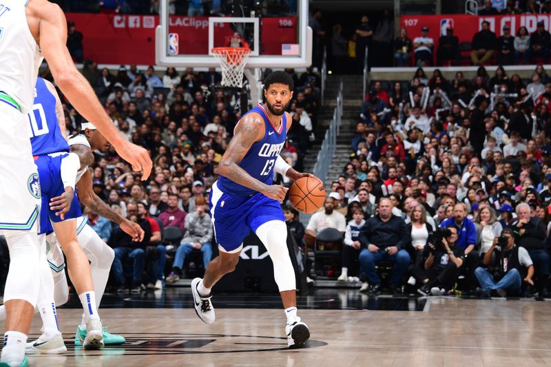 LOS ANGELES, CA - MARCH 12:  Paul George #13 of the LA Clippers handles the ball during the game against the Minnesota Timberwolves on March 12, 2024 at Crypto.Com Arena in Los Angeles, California. NOTE TO USER: User expressly acknowledges and agrees that, by downloading and/or using this Photograph, user is consenting to the terms and conditions of the Getty Images License Agreement. Mandatory Copyright Notice: Copyright 2024 NBAE (Photo by Tyler Ross/NBAE via Getty Images)