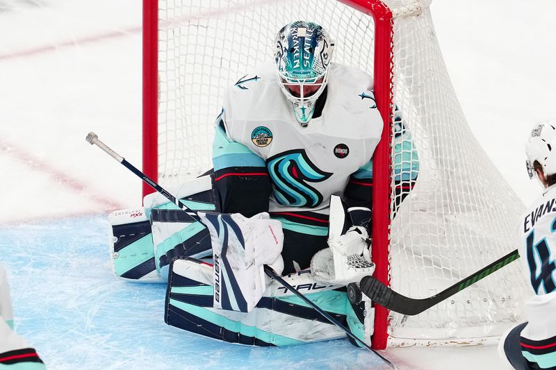 Apr 10, 2025; Las Vegas, Nevada, USA; Seattle Kraken goaltender Joey Daccord (35) makes a save against the Vegas Golden Knights during the third period at T-Mobile Arena. Mandatory Credit: Stephen R. Sylvanie-Imagn Images