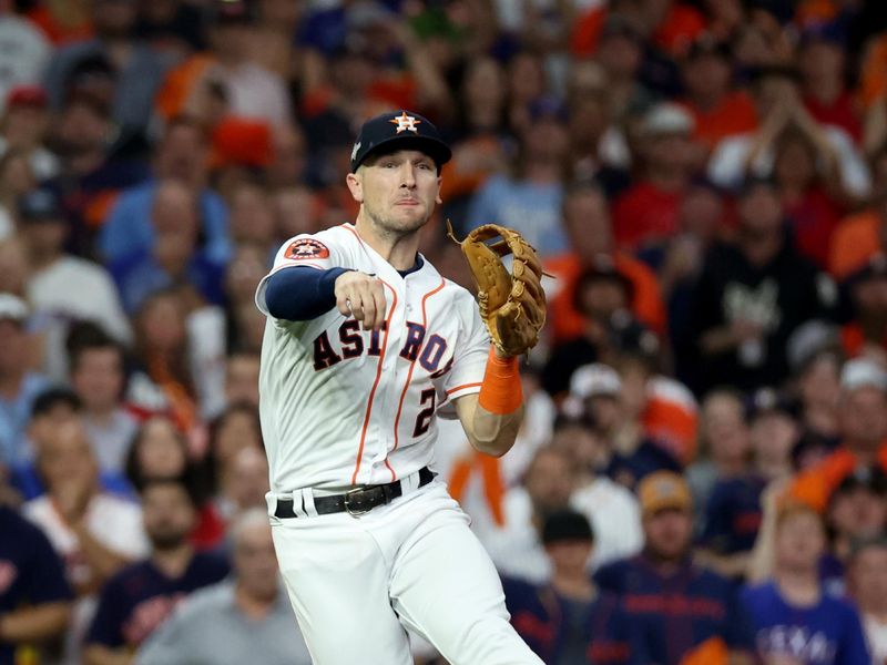 Oct 23, 2023; Houston, Texas, USA; Houston Astros third baseman Alex Bregman (2) throws to first for an out during the second inning of game seven in the ALCS against the Texas Rangers for the 2023 MLB playoffs at Minute Maid Park.  Mandatory Credit: Erik Williams-USA TODAY Sports