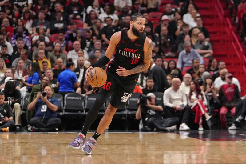 MIAMI, FL - JANUARY 19: Caleb Martin #16 of the Miami Heat dribbles the ball during the game against the Atlanta Hawks on January 19, 2024 at Kaseya Center in Miami, Florida. NOTE TO USER: User expressly acknowledges and agrees that, by downloading and or using this Photograph, user is consenting to the terms and conditions of the Getty Images License Agreement. Mandatory Copyright Notice: Copyright 2024 NBAE (Photo by Eric Espada/NBAE via Getty Images)