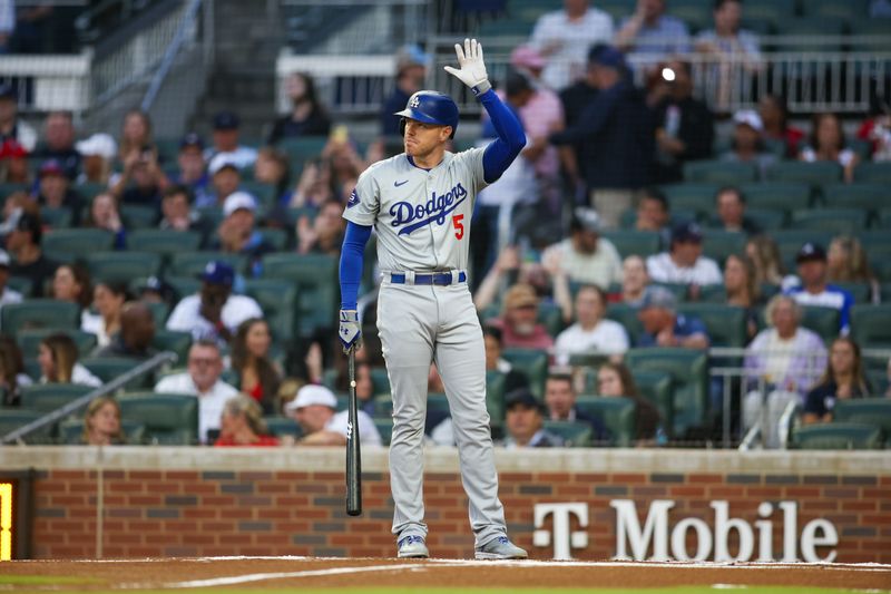 Sep 13, 2024; Atlanta, Georgia, USA; Los Angeles Dodgers first baseman Freddie Freeman (5) acknowledges the crowd before an at bat against the Atlanta Braves in the first inning at Truist Park. Mandatory Credit: Brett Davis-Imagn Images