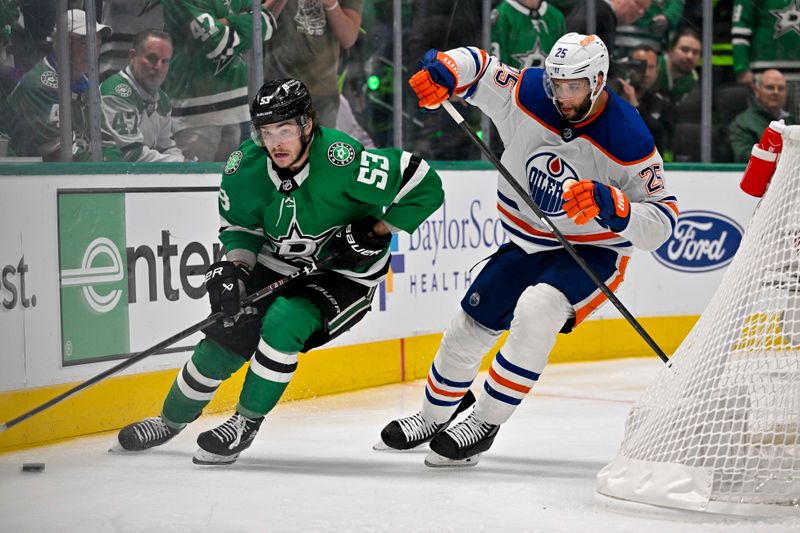 May 23, 2024; Dallas, Texas, USA; Dallas Stars center Wyatt Johnston (53) and Edmonton Oilers defenseman Darnell Nurse (25) chase the puck during the overtime period in game one of the Western Conference Final of the 2024 Stanley Cup Playoffs at American Airlines Center. Mandatory Credit: Jerome Miron-USA TODAY Sports