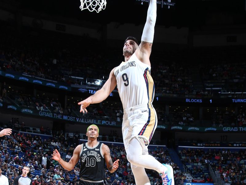 NEW ORLEANS, LA - DECEMBER 22: Willy Hernangomez #9 of the New Orleans Pelicans drives to the basket during the game against the San Antonio Spurs on December 22, 2022 at the Smoothie King Center in New Orleans, Louisiana. NOTE TO USER: User expressly acknowledges and agrees that, by downloading and or using this Photograph, user is consenting to the terms and conditions of the Getty Images License Agreement. Mandatory Copyright Notice: Copyright 2022 NBAE (Photo by Layne Murdoch Jr./NBAE via Getty Images)