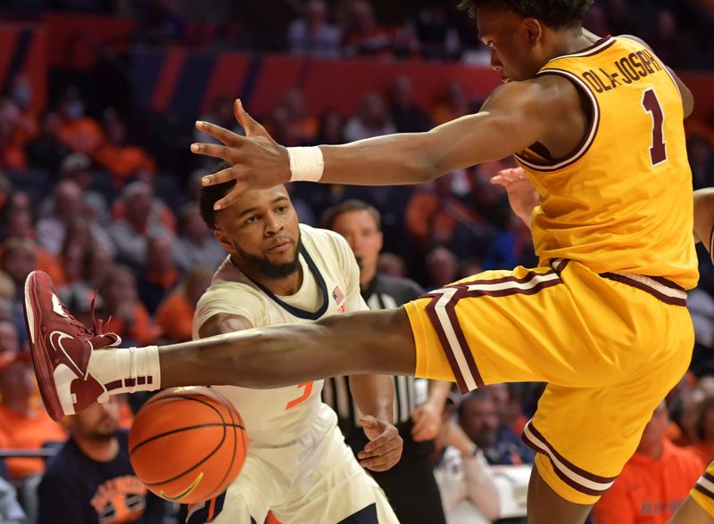 Feb 20, 2023; Champaign, Illinois, USA;  Illinois Fighting Illini guard Jayden Epps (3) passes the ball as Minnesota Golden Gophers forward Joshua Ola-Joseph (1) pressures him during the second half at State Farm Center. Mandatory Credit: Ron Johnson-USA TODAY Sports