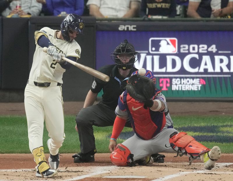 Oct 1, 2024; Milwaukee, Wisconsin, USA; Milwaukee Brewers second base Brice Turang (2) hits a double against the New York Mets during the first inning in game game one of the Wildcard round for the 2024 MLB Playoffs against the New York Mets at American Family Field. Mandatory Credit: Mark Hoffman/USA TODAY Network via Imagn Images