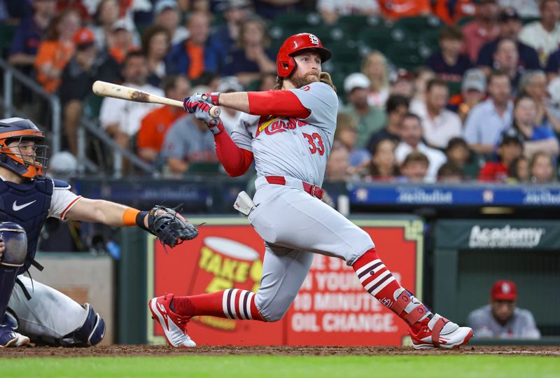 Jun 5, 2024; Houston, Texas, USA; St. Louis Cardinals left fielder Brendan Donovan (33). hits an RBI single during the fifth inning against the Houston Astros  at Minute Maid Park. Mandatory Credit: Troy Taormina-USA TODAY Sports