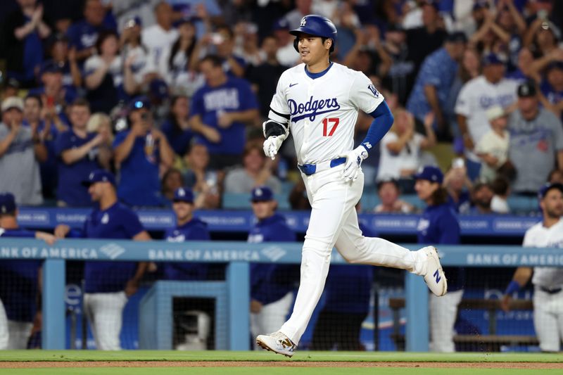 Sep 11, 2024; Los Angeles, California, USA;  Los Angeles Dodgers designated hitter Shohei Ohtani (17) runs around bases on a home run during the first inning against the Chicago Cubs at Dodger Stadium. Mandatory Credit: Kiyoshi Mio-Imagn Images