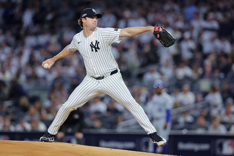 Oct 5, 2024; Bronx, New York, USA; New York Yankees pitcher Gerrit Cole (45) throws a pitch during the first inning against Kansas City Royals during game one of the ALDS for the 2024 MLB Playoffs at Yankee Stadium. Mandatory Credit: Brad Penner-Imagn Images