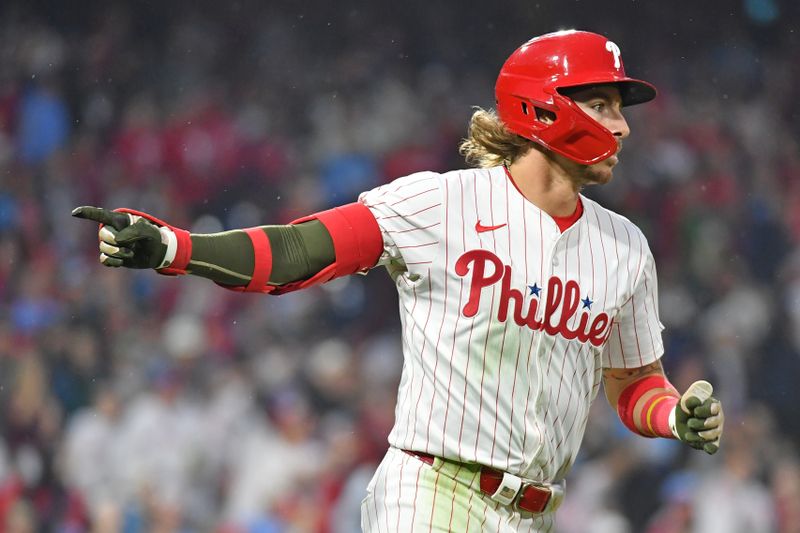 May 19, 2024; Philadelphia, Pennsylvania, USA; Philadelphia Phillies second base Bryson Stott (5) hits a home run during the seventh inning against the Washington Nationals at Citizens Bank Park. Mandatory Credit: Eric Hartline-USA TODAY Sports