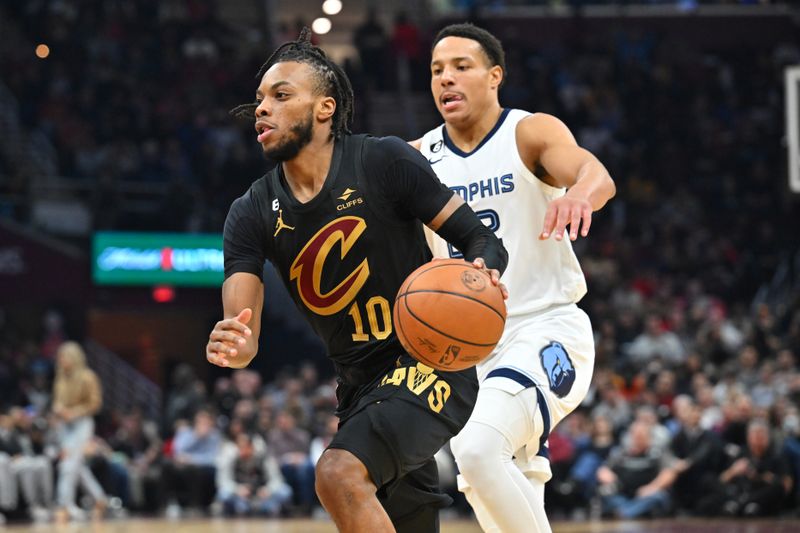 CLEVELAND, OHIO - FEBRUARY 02: Darius Garland #10 of the Cleveland Cavaliers drives around Desmond Bane #22 of the Memphis Grizzlies during the second quarter at Rocket Mortgage Fieldhouse on February 02, 2023 in Cleveland, Ohio. NOTE TO USER: User expressly acknowledges and agrees that, by downloading and or using this photograph, User is consenting to the terms and conditions of the Getty Images License Agreement. (Photo by Jason Miller/Getty Images)