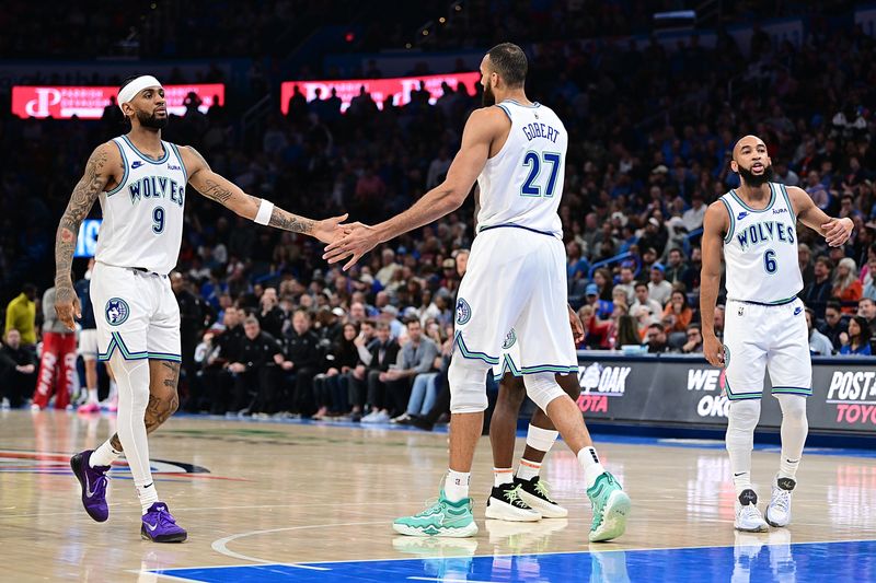 OKLAHOMA CITY, OKLAHOMA - JANUARY 29: Rudy Gobert #27 and Nickeil Alexander-Walker #9 of the Minnesota Timberwolves celebrate during the second half against the Oklahoma City Thunder at Paycom Center on January 29, 2024 in Oklahoma City, Oklahoma. NOTE TO USER: User expressly acknowledges and agrees that, by downloading and or using this Photograph, user is consenting to the terms and conditions of the Getty Images License Agreement. (Photo by Joshua Gateley/Getty Images)