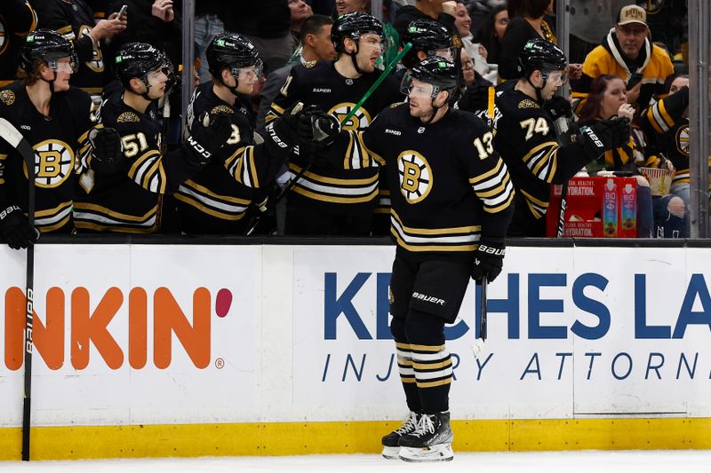 Jan 22, 2024; Boston, Massachusetts, USA; Boston Bruins center Charlie Coyle (13) is congratulated at the bench after scoring against the Winnipeg Jets during the first period at TD Garden. Mandatory Credit: Winslow Townson-USA TODAY Sports