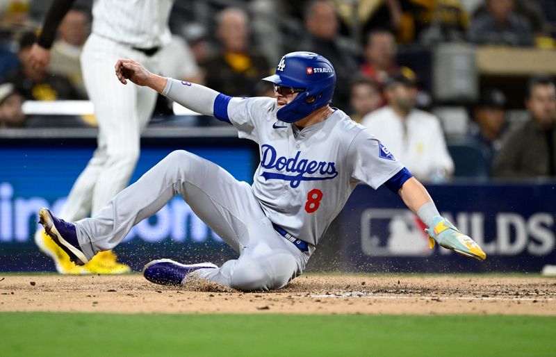 Oct 9, 2024; San Diego, California, USA; Los Angeles Dodgers third baseman Enrique Hernandez (8) scores in the second inning against the San Diego Padres during game four of the NLDS for the 2024 MLB Playoffs at Petco Park.  Mandatory Credit: Denis Poroy-Imagn Images