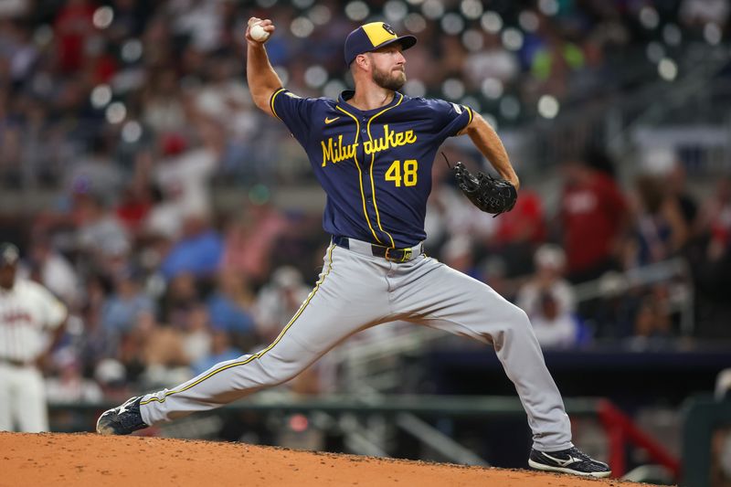 Aug 6, 2024; Atlanta, Georgia, USA; Milwaukee Brewers starting pitcher Colin Rea (48) throws against the Atlanta Braves in the seventh inning at Truist Park. Mandatory Credit: Brett Davis-USA TODAY Sports
