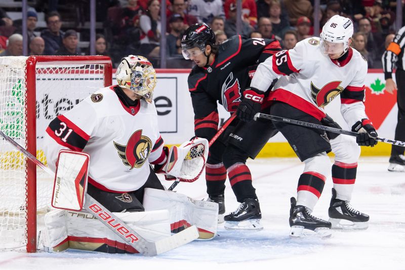 Mar 17, 2024; Ottawa, Ontario, CAN; Carolina Hurricanes center Seth Jarvis (24) fans on the puck in front of Ottawa Senators goalie Anton Forsberg (31) in the second period at the Canadian Tire Centre. Mandatory Credit: Marc DesRosiers-USA TODAY Sports