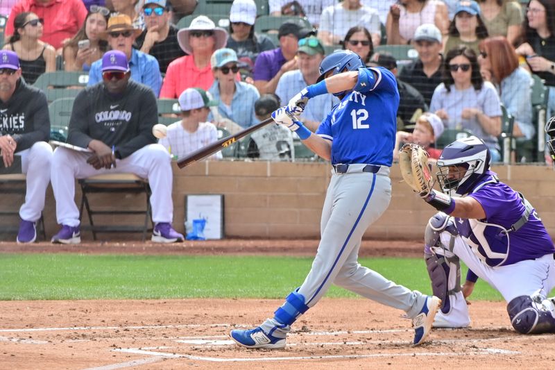 Mar 12, 2024; Salt River Pima-Maricopa, Arizona, USA;  Kansas City Royals shortstop Nick Loftin (12) singles in the second inning against the Colorado Rockies during a spring training game at Salt River Fields at Talking Stick. Mandatory Credit: Matt Kartozian-USA TODAY Sports