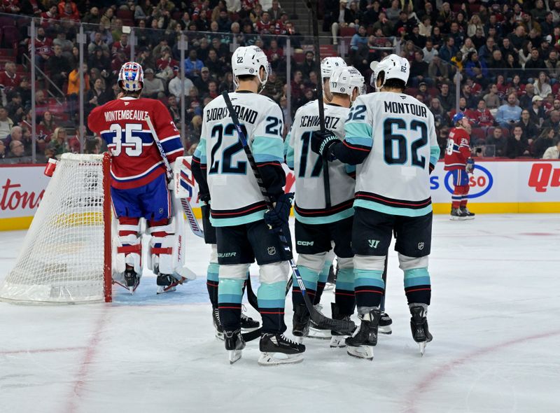 Oct 29, 2024; Montreal, Quebec, CAN; Seattle Kraken forward Jaden Schwartz (17) celebrates with teammates after scoring a goal against Montreal Canadiens goalie Sam Montembeault (35) during the first period at the Bell Centre. Mandatory Credit: Eric Bolte-Imagn Images