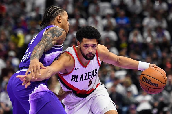 SALT LAKE CITY, UTAH - NOVEMBER 14: Skylar Mays #5 of the Portland Trail Blazers drives into Keyonte George #3 of the Utah Jazz during the second half of an NBA In-Season Tournament game at Delta Center on November 14, 2023 in Salt Lake City, Utah. NOTE TO USER: User expressly acknowledges and agrees that, by downloading and or using this photograph, User is consenting to the terms and conditions of the Getty Images License Agreement. (Photo by Alex Goodlett/Getty Images)