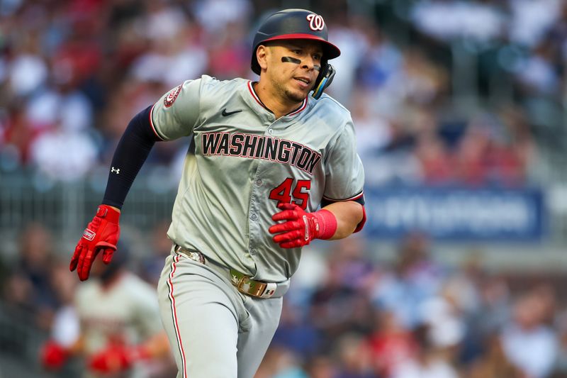 May 30, 2024; Atlanta, Georgia, USA; Washington Nationals first baseman Joey Meneses (45) rounds first on a two-run double against the Atlanta Braves in the third inning at Truist Park. Mandatory Credit: Brett Davis-USA TODAY Sports