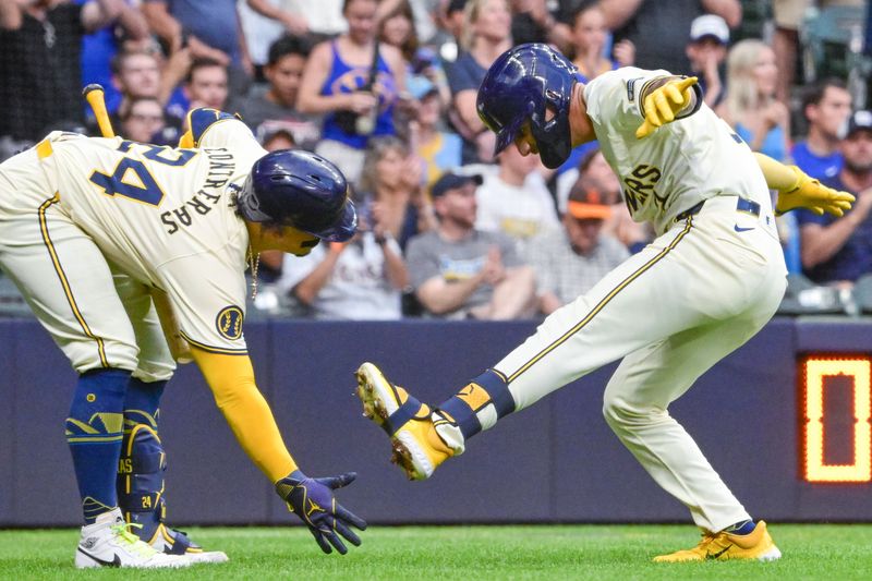 Jun 25, 2024; Milwaukee, Wisconsin, USA; Milwaukee Brewers third baseman Joey Ortiz (3) celebrates with catcher William Contreras (24) after hitting a solo home run against the Texas Rangers in the fifth inningat American Family Field. Mandatory Credit: Benny Sieu-USA TODAY Sports