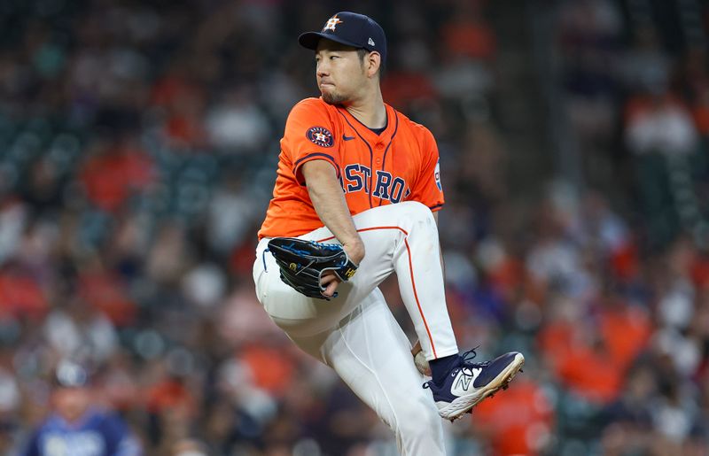 Aug 2, 2024; Houston, Texas, USA; Houston Astros starting pitcher Yusei Kikuchi (16) delivers a pitch during the first inning against the Tampa Bay Rays at Minute Maid Park. Mandatory Credit: Troy Taormina-USA TODAY Sports