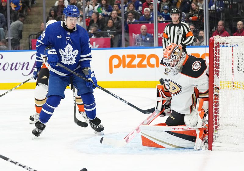 Feb 17, 2024; Toronto, Ontario, CAN; Anaheim Ducks goaltender Lukas Dostal (1) stops the puck as Toronto Maple Leafs left wing Todd Bertuzzi (59) looks for the rebound during the first period at Scotiabank Arena. Mandatory Credit: Nick Turchiaro-USA TODAY Sports