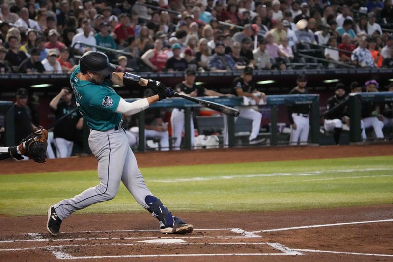 Jul 29, 2023; Phoenix, Arizona, USA; Seattle Mariners catcher Tom Murphy (2) hits a sacrifice fly against the Arizona Diamondbacks during the second inning at Chase Field. Mandatory Credit: Joe Camporeale-USA TODAY Sports