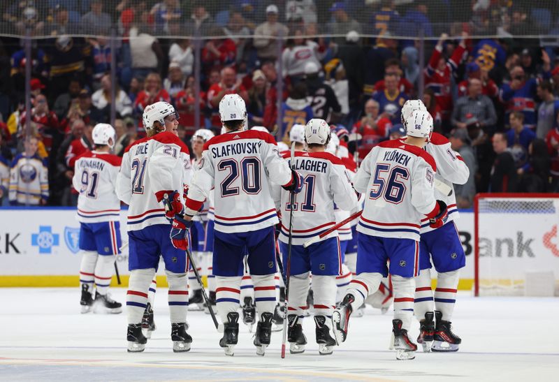 Dec 9, 2023; Buffalo, New York, USA;  The Montreal Canadiens celebrate a win over the Buffalo Sabres at KeyBank Center. Mandatory Credit: Timothy T. Ludwig-USA TODAY Sports