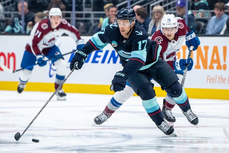 Oct 22, 2024; Seattle, Washington, USA;  Seattle Kraken forward Jaden Schwartz (17) skates against Colorado Avalanche defenseman Sam Malinski (70) during the second period at Climate Pledge Arena. Mandatory Credit: Stephen Brashear-Imagn Images