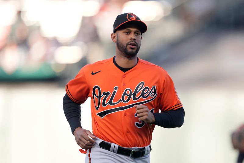 Jun 3, 2023; San Francisco, California, USA;  Baltimore Orioles center fielder Aaron Hicks (34) jogs on the field before the game against the San Francisco Giants at Oracle Park. Mandatory Credit: Darren Yamashita-USA TODAY Sports